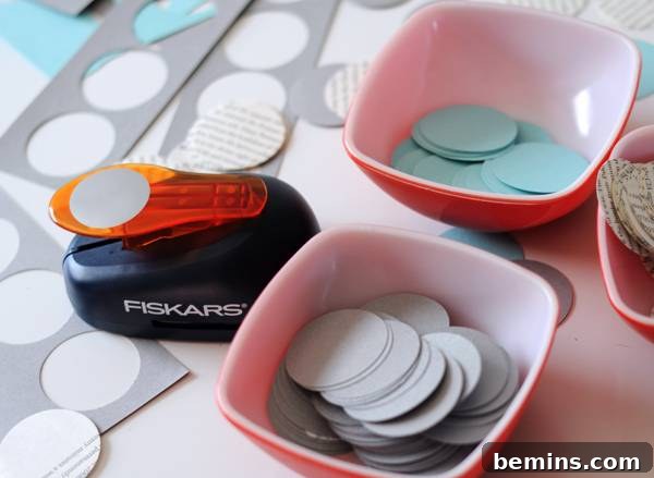 Budget-Friendly Modern Paper Holiday Garland 3 Materials for making paper garland: books, cardstock, circle punch, and sewing machine