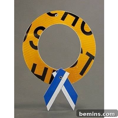 Ultimate DIY Holiday Wreath Ideas 7 An yellow, black, blue and white Christmas wreath made of recycled material