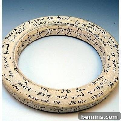 Ultimate DIY Holiday Wreath Ideas 9 A round tire shape object with words written over it.