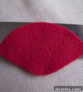 Cutting the felt for Santa's hat