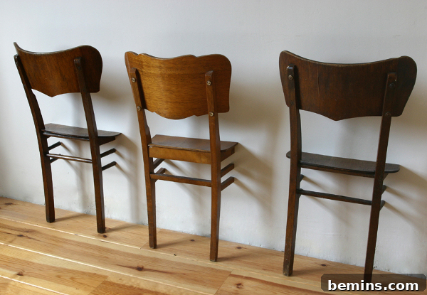 Antique chairs repurposed as dress boys, showcasing an elegant design
