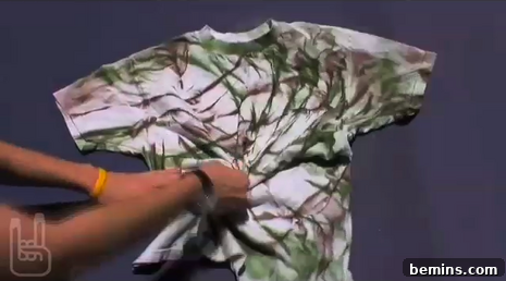 Woman rolling shirt for dyeing