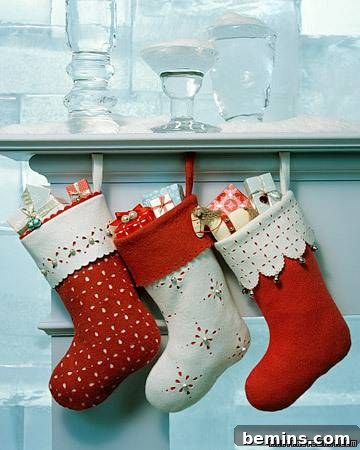 Christmas Stocking Spectacular 4 Stockings full of presents hanging below a shelf.