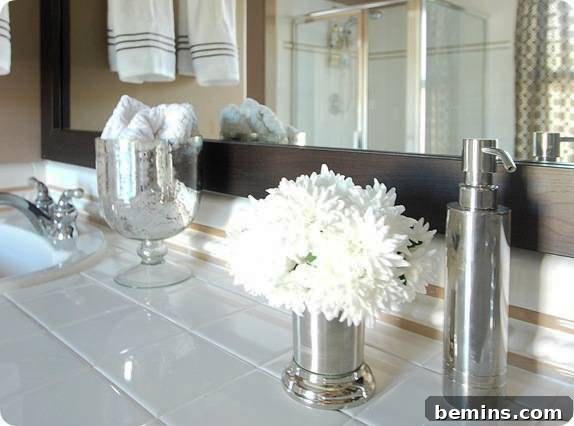Elevate Your Builder's Oak Vanity 5 A glass, vase and steel soap dispenser lying near the washbasin.