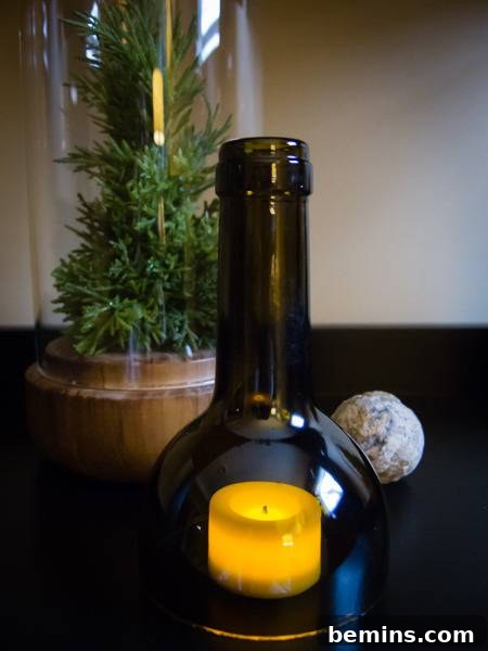 A glass bottle on a table, ready to be cut.
