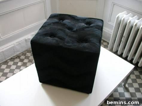 Experience furniture designs through a thrifty cube ottoman transformation.