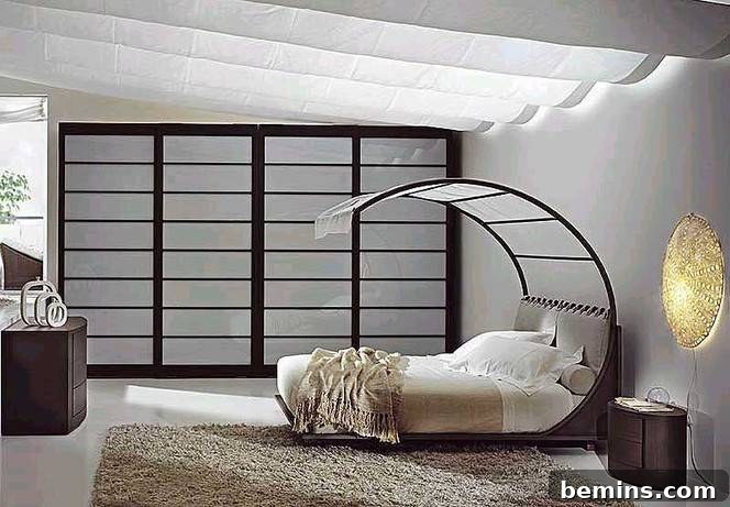 6 Innovative Bed Cocoons 3 A bedroom with a bed with a curving round headboard with nearly covers the entire bed, sitting atop a shaggy rug.