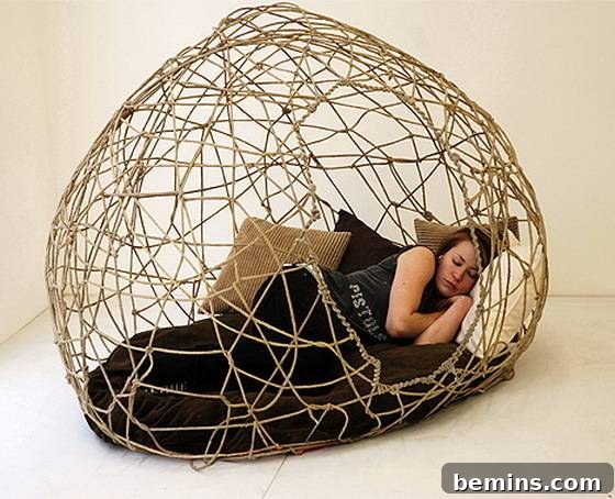 6 Innovative Bed Cocoons 7 Woman sleeping on the wired cocoon bed.