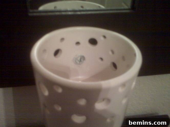 Malma Mirror Sconce: Detail of Screw Placement and Construction