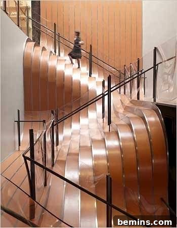 A modern staircase made of steel and glass, showcasing its clean lines and contemporary aesthetic.