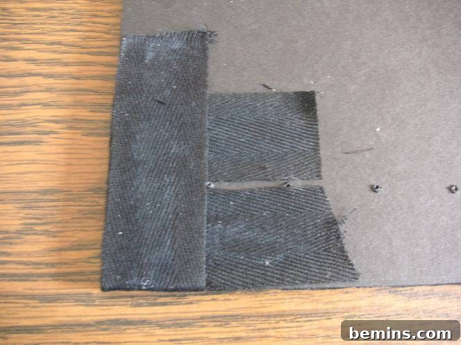 Securing the tape ends to the back of the frame