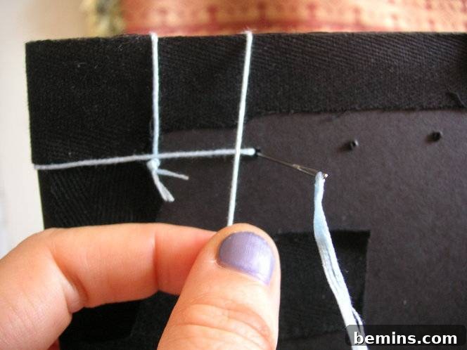 Doubling back through the stitching hole