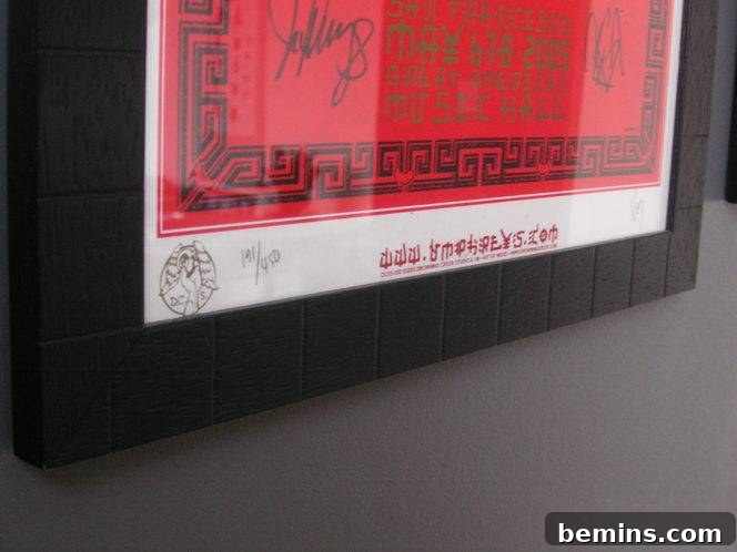Finished panorama frame next to a concert poster