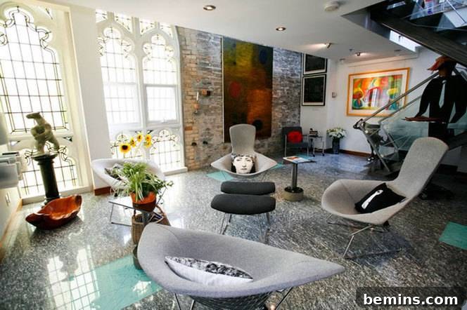 Sacred Spaces: Loft Conversions in Former Churches 3 Stylish Living Room with Gray Chairs, Indoor Plants, and Flowers in Abby Lofts