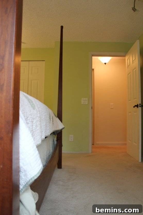 Elegant Newlywed Bedroom Sanctuary Unveiled 6 Detailed view of fresh paint and new molding installation