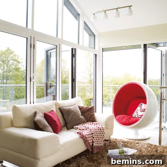 Comfortable and stylish conservatory design with modern furniture and ample natural light.