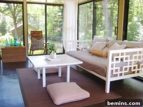 See-through home design with a modern porch seamlessly blending indoor and outdoor living.