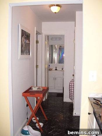 Hallway with ironing board, representing a disorganized and uninspired space