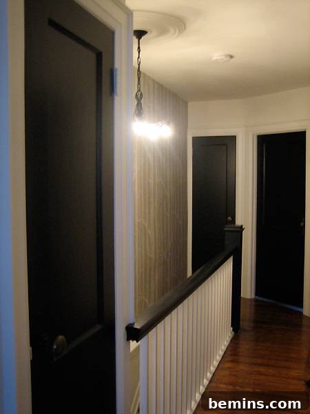 Hallway transformed with a bold black and white color scheme