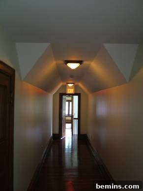 The High Gate Carriage House hallway after renovation, revitalized and transformed into a jewel