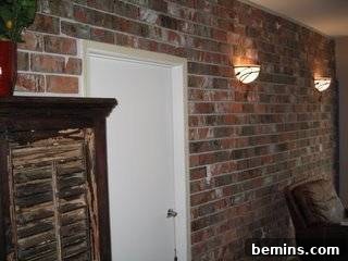 Brick by Brick: Creating a Loft-Style Interior Wall 8 Light sconces hanging from the brick wall