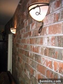 Brick by Brick: Creating a Loft-Style Interior Wall 9 Lights hanging on the outside of a brick building, inspiring the project