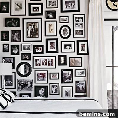 Gallery wall of black and white framed photographs creating a classic and timeless aesthetic.