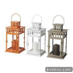 Three lanterns with candles next to each in copper, white, and silver finishes.