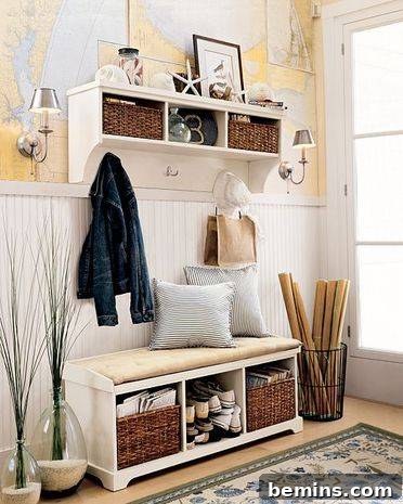 A white bench and shelves in an area near a window are used for organizing.