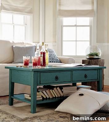 A coffee table with several bottles and glasses in a living room