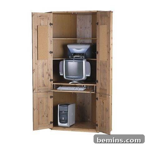 A desktop computer sits on wooden shelving.