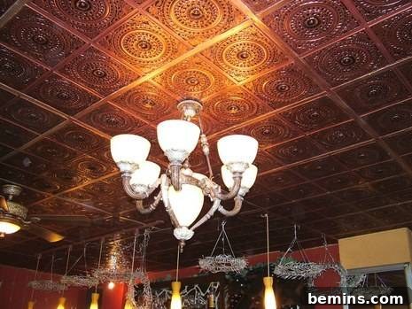 The completed ceiling with new tiles and chandeliers.