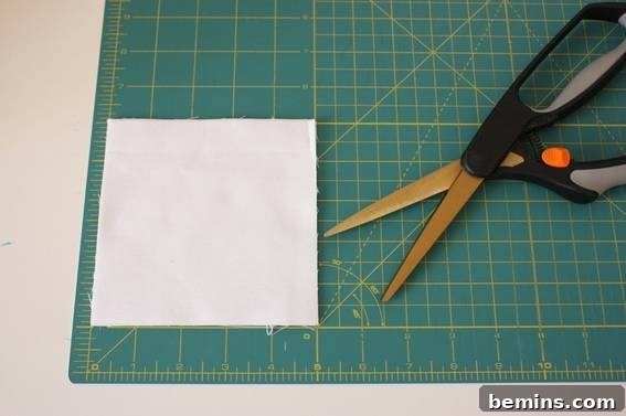 Preventing Tablecloth Fly-Aways: A Simple Outdoor Dining Hack 5 Cutting fabric squares for tablecloth weights