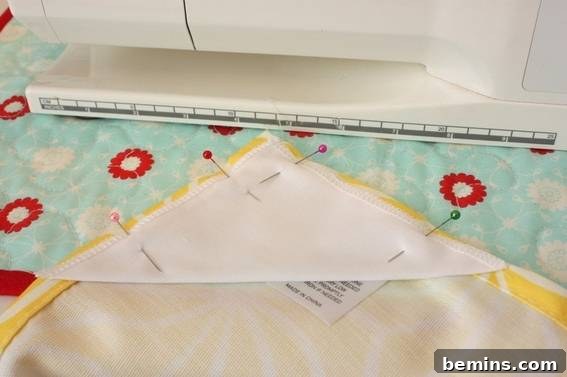 Preventing Tablecloth Fly-Aways: A Simple Outdoor Dining Hack 9 Pinning the triangles to the tablecloth corners
