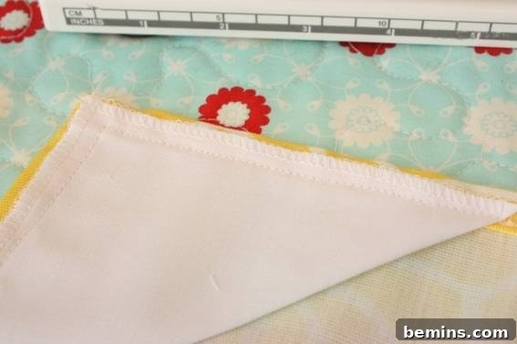 Preventing Tablecloth Fly-Aways: A Simple Outdoor Dining Hack 10 Sewing the triangles to the tablecloth
