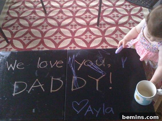 Ayla, our little artist, delightedly drawing on her newly painted chalkboard-topped coffee tables on the porch