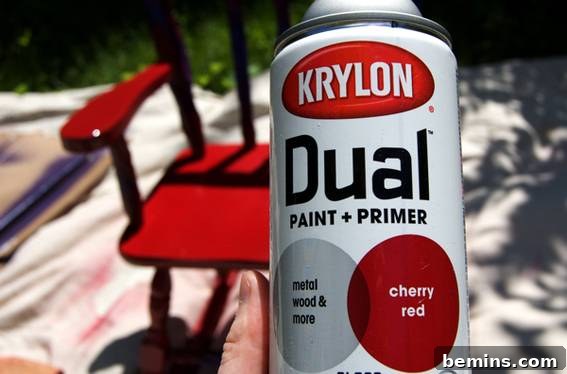 Man proudly displaying a can of Krylon Dual Paint + Primer spray paint, a versatile DIY tool