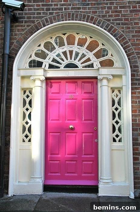 Pink Dublin door, showcasing a playful and unexpected entrance.