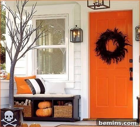 Orange color front door with lamps on both sides, showcasing a warm and inviting entrance.