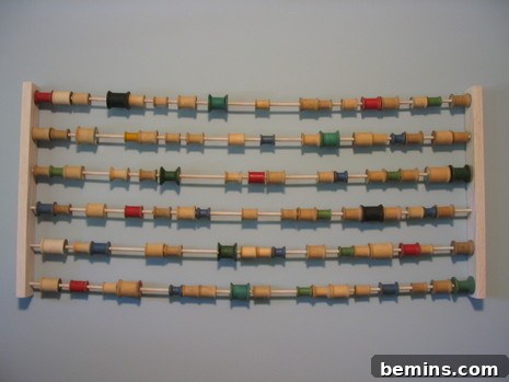 Art abacus using spools of thread