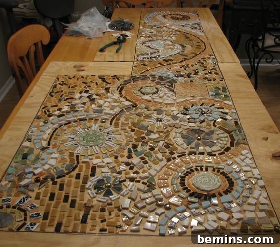 The mosaic design laid out on the plywood template
