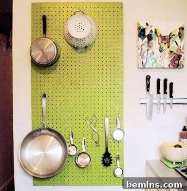 Kitchen utensils hanging on a pegboard