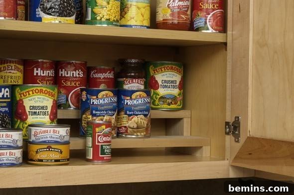 Tiered shelves in a kitchen cabinet