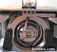 Sewing Machine Basics: A Guy's (and Gal's) Guide to Stitches & Seams Crafting Confidence: Mastering Stitches and Seams for Everyone 5 A close-up of the bobbin case of a sewing machine