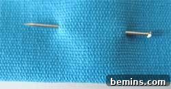 Sewing Machine Basics: A Guy's (and Gal's) Guide to Stitches & Seams Crafting Confidence: Mastering Stitches and Seams for Everyone 8 A close-up of a needle pinned on a piece of fabric
