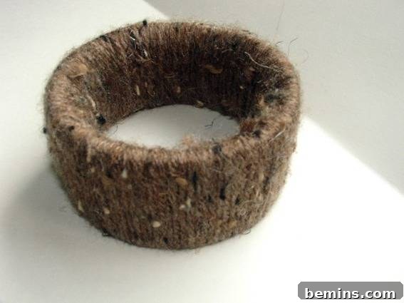 The finished DIY yarn bracelet, a stylish and repurposed accessory