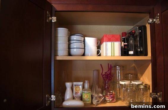 Two shelves with mason jars, coffee cups and other assorted trinkets.