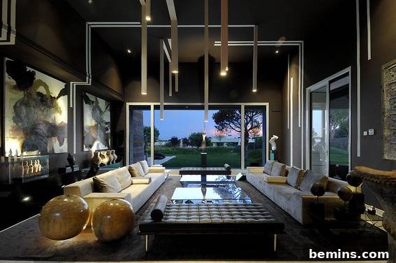 A sleek, modern gothic living space with minimalist furniture and a moody ambiance, designed with contemporary elegance.
