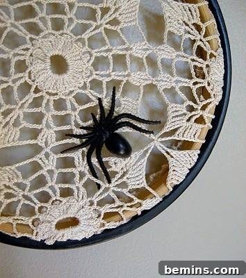 A black spider is hanging the cloth.