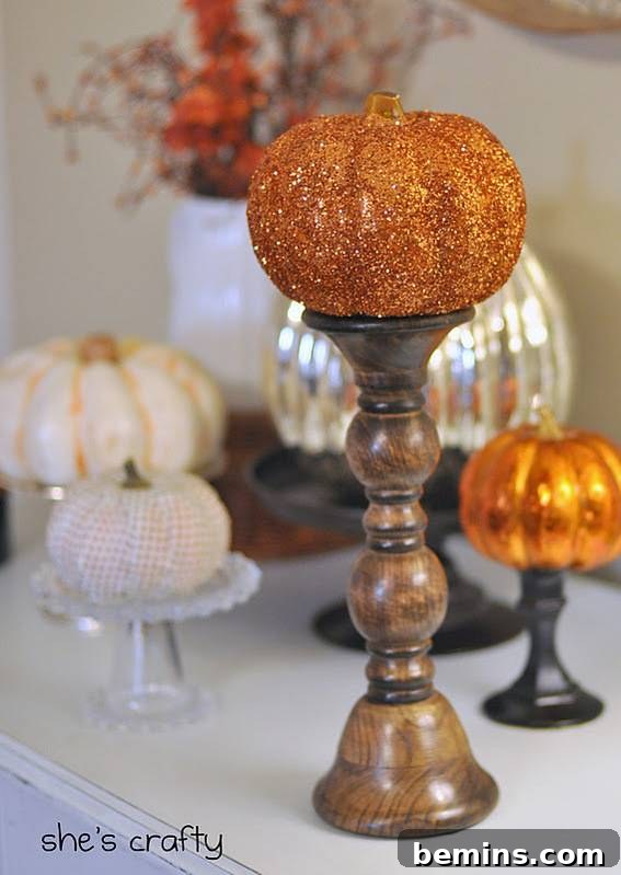 Glitter-Covered Pumpkins on Candlesticks